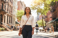 South Asian woman wearing black full-frame FL-41 glasses on city street